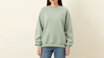 Person Wearing Oversized Sage Green Sweatshirt and Blue Jeans - Fashion - AI generated image