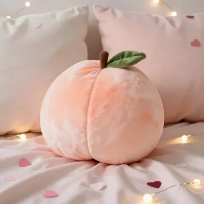 Peach-Shaped Plush Pillow Softly Lit - Furniture - AI generated image