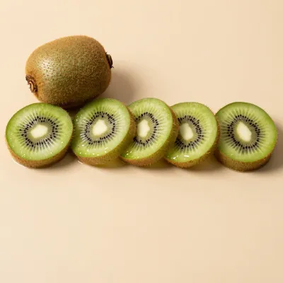 Kiwi Slices Arranged in Line with Whole Kiwi - Fruit - AI generated image