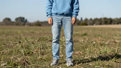 Person in Light Blue Hoodie Standing in Field - People - AI generated image