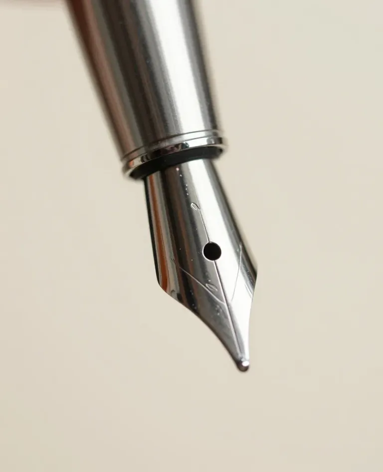Fountain Pen Nib Close-Up Reflective Surface - Stationery - AI generated image