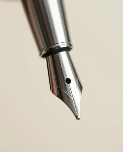 Fountain Pen Nib Close-Up Reflective Surface - Stationery - AI generated image