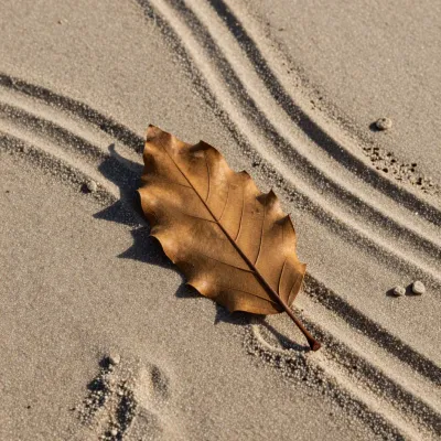 Oak Leaf Resting on Sandy Beach - Nature - AI generated image