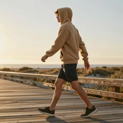 Tan Hoodie Walker on Wooden Boardwalk at Sunset - People - AI generated image