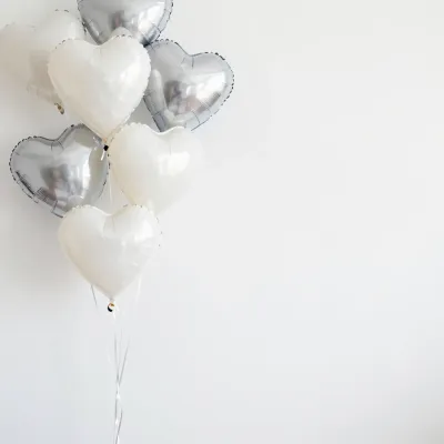 White & Silver Heart Balloons Clustered Against Clean Background - Event - AI generated image