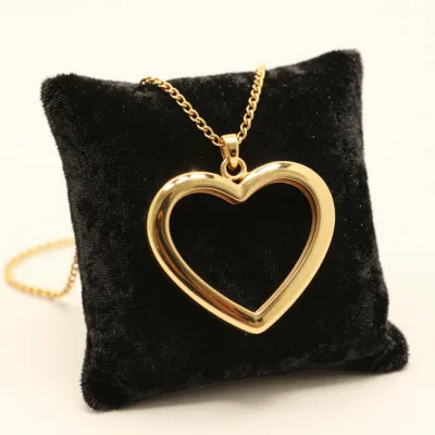 Golden Heart Locket on Velvet Cushion - Jewelry - AI generated image