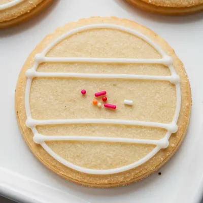 Sugar Cookie with White Icing Lines and Colorful Sprinkles - Food - AI generated image