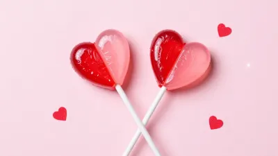 Heart-Shaped Lollipops on Pink Background - Food - AI generated image