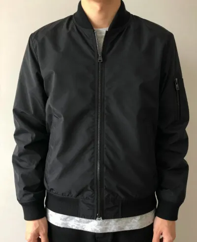 Person Wearing Black Bomber Jacket - Fashion - AI generated image