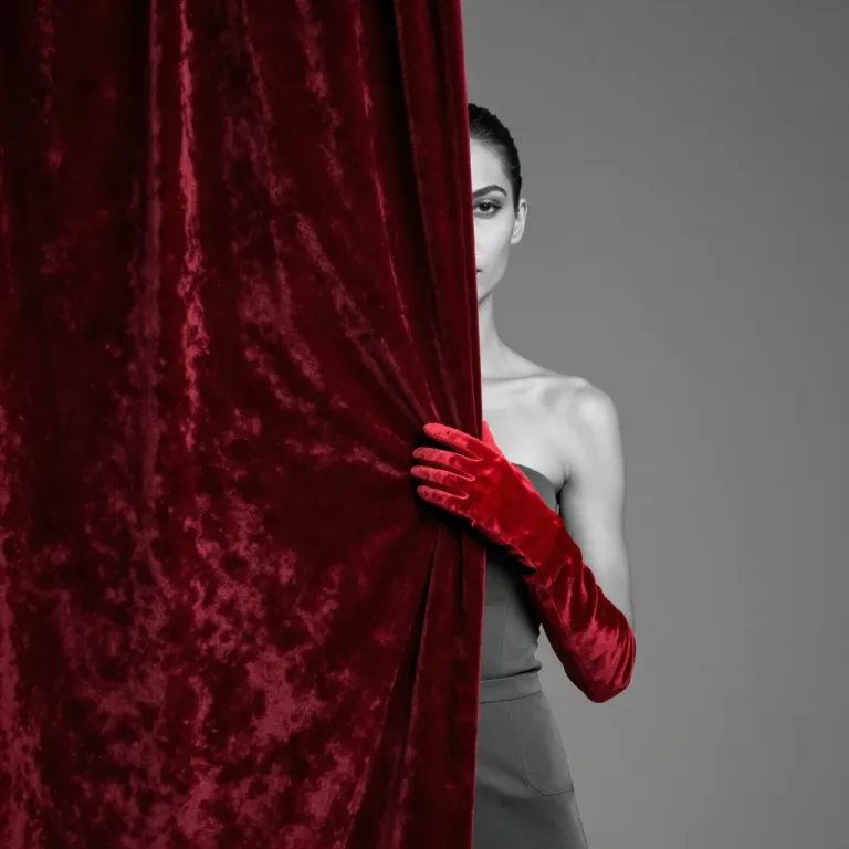 Woman Peeking Behind Velvet Curtain - Fashion - AI generated image