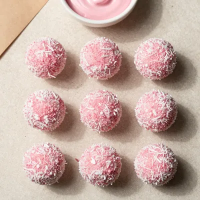 Coconut Truffle Bites with Pink Icing - Food - AI generated image