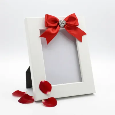 White Photo Frame with Red Satin Ribbon and Heart - Decor - AI generated image