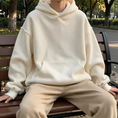 Person in Cream Hoodie Relaxing on Park Bench - Fashion - AI generated image