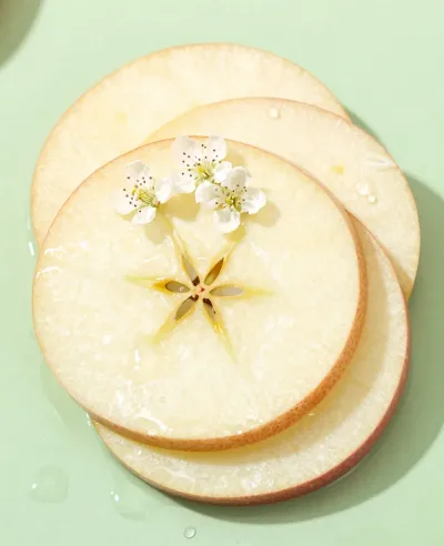 Apple Slices with Blossoms Arranged in Circles - Food - AI generated image