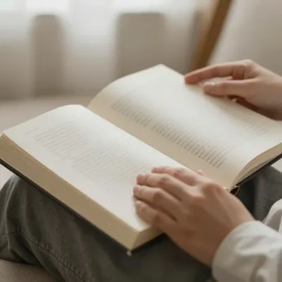 Hands Holding Open Book in Soft Light - Reading - AI generated image