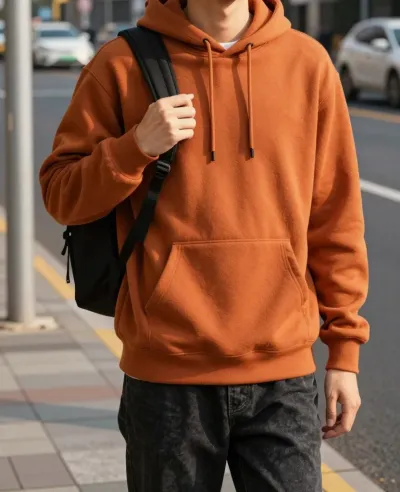 Person in Orange Hoodie at Bus Stop - Fashion - AI generated image