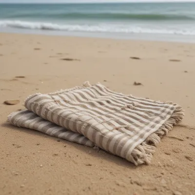 Folded Beach Towel with Fringed Edges on Sandy Beach - Beach - AI generated image