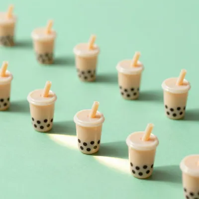 Miniature Bubble Tea Cups Arranged on Mint Green Background - Food - AI generated image