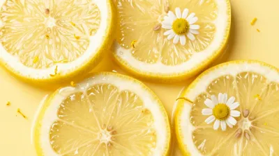 Sliced Lemons with Chamomile Blossoms - Food - AI generated image