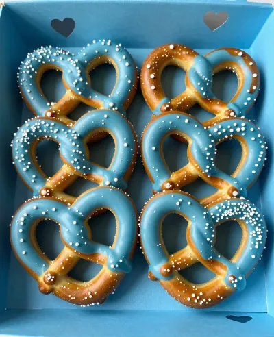 Pretzel Heart Twists with Blue Glaze - Food - AI generated image