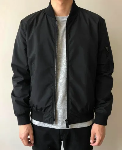 Person in Black Bomber Jacket and Gray T-Shirt - Fashion - AI generated image