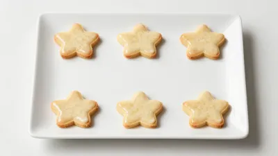 Star-Shaped Sugar Cookies with Glossy Icing - Food - AI generated image