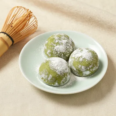Matcha Mochi Trio with Powdered Sugar - Food - AI generated image