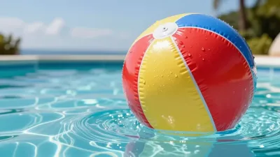 Inflatable Beach Ball Floating in Pool - Summer - AI generated image