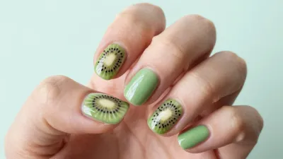 Hand Holding Kiwi Slice with Matte Nails - Food - AI generated image