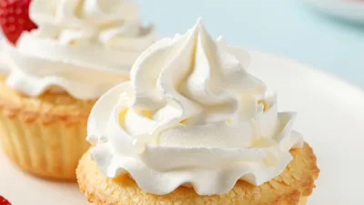 Piped Whipped Cream Cupcake Close-Up - Food - AI generated image