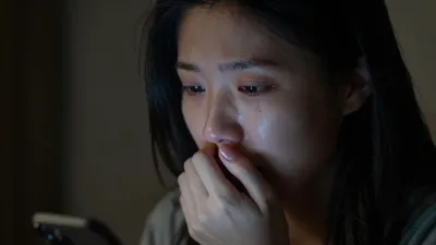 Anxious Woman Crying by Phone Glow - Emotion - AI generated image