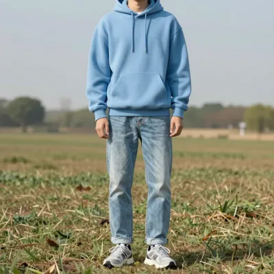 Person in Sky-Blue Hoodie Standing in Open Field - People - AI generated image