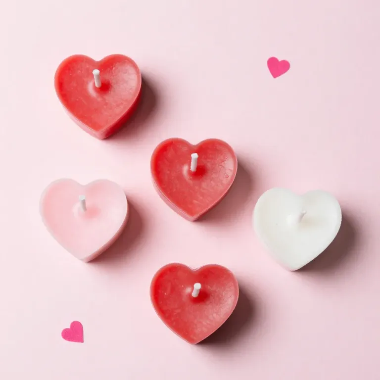 Heart-Shaped Candles Softly Lit on Pink Background - Candles - AI generated image