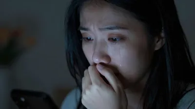 Anxious Woman with Phone Glow - Portrait - AI generated image