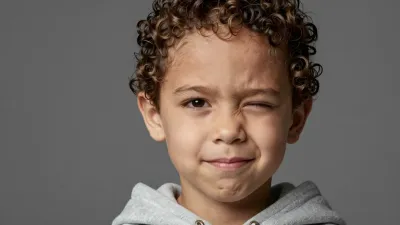 Curly-Haired Child Covering Face with Hands - Portrait - AI generated image