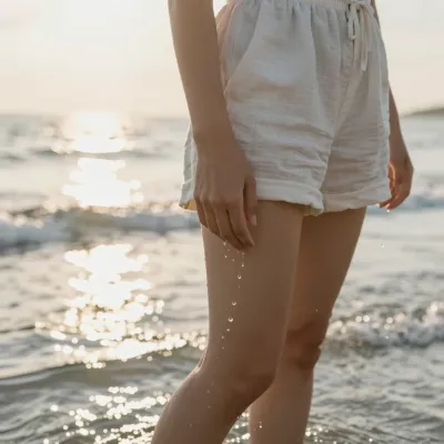 Woman Walking Along Beach with Wet Sand - People - AI generated image
