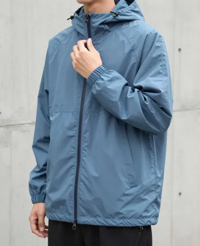 Person Adjusting Blue Windbreaker Zipper - Fashion - AI generated image
