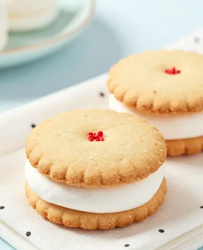Golden-Brown Marshmallow Sandwiches with Red Dot - Food - AI generated image