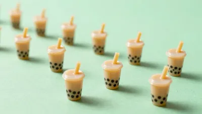 Miniature Bubble Tea Cups Clustered on Mint Green - Food - AI generated image