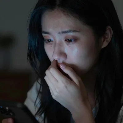 Anxious Woman Holding Phone in Low Light - Portrait - AI generated image