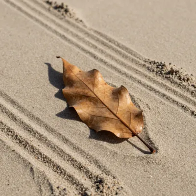 Weathered Leaf Resting on Furrowed Sand - Nature - AI generated image