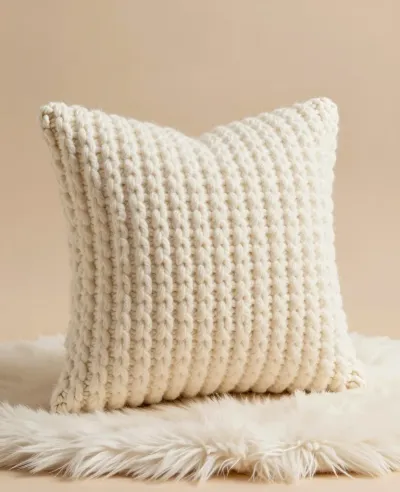 Cream Knit Pillow Softly Lit - Furniture - AI generated image