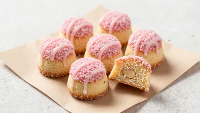 Almond Tea Cakes with Pink Drizzle and Sprinkles - Food - AI generated image