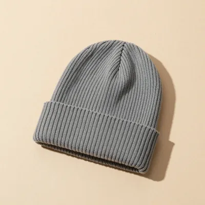 Folded Gray Beanie Soft Ribbed Texture - Fashion - AI generated image