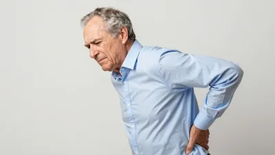 Elderly Man with Backache Leaning Forward - People - AI generated image